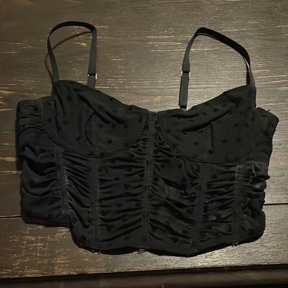 Worn only a couple times, cute and stylish corset top with black velvet hearts